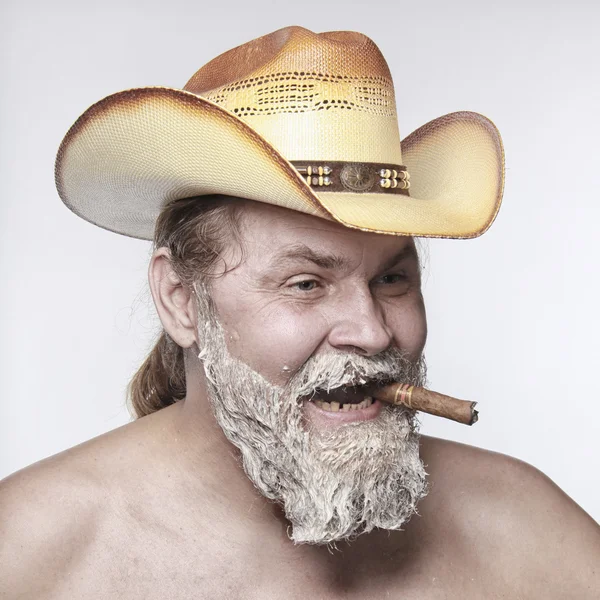 Cowboy smoking a cigar — Stock Photo, Image