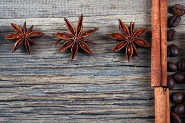 close-up still-life of cinnamon, star anise and coffe on magic Christmas holiday on background wooden boards studio