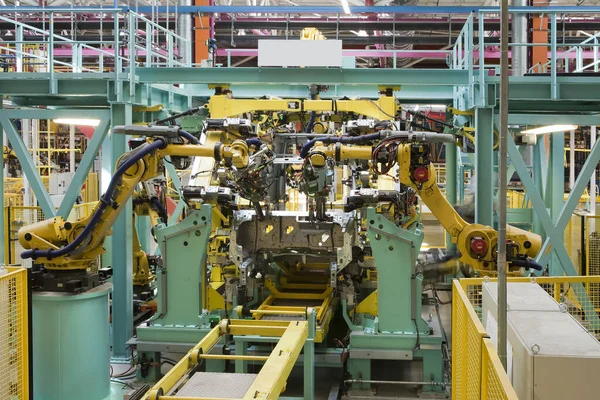 interior of modern automated assembly line for cars in during operation