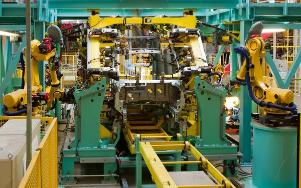 interior of modern automated assembly line for cars in during operation