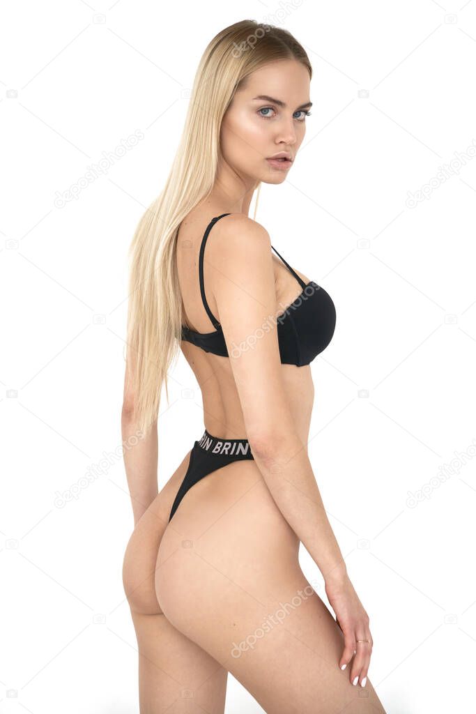Blonde girl in black underwear posing in white clear studio with amazing color and skintone