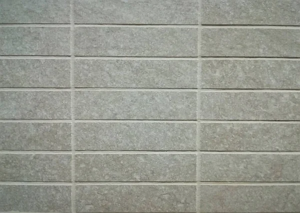 Grey tiles on the wall as background — Stock Photo, Image