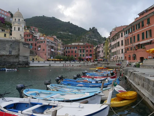 stock image boats moored in the bay of the picturesque village of Vernazza