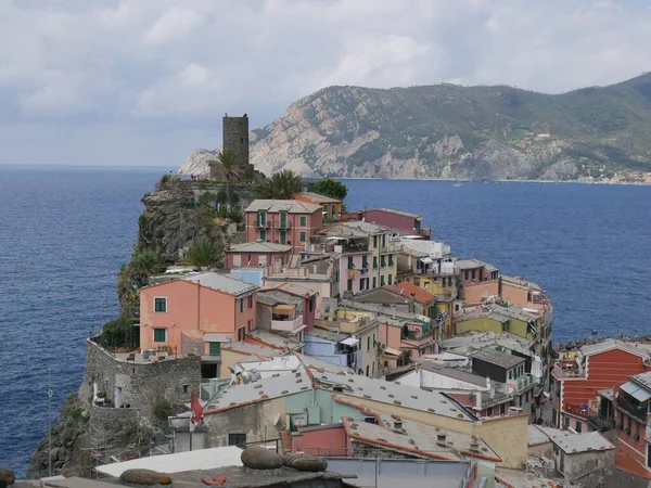 panorama of the picturesque village of Vernazza behind the castle with the sea in the background