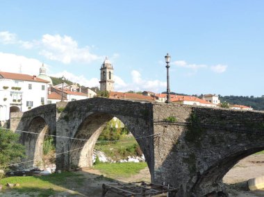 Pontremoli - panorama of the medieval village from Cresa bridge on the Verde torrent clipart