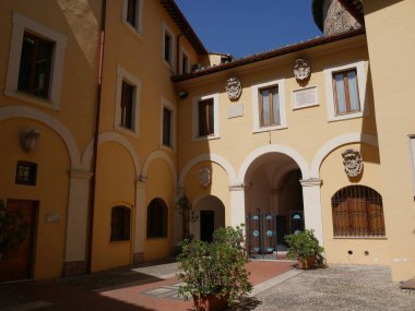 Terni  courtyard of the cathedral with religious coats of arms clipart