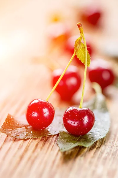 Fresh red cherry on wooden table background — Stock Photo, Image