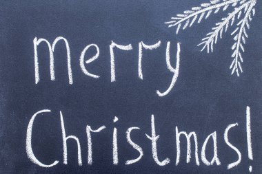 Neşeli Noel el Siyah Kara tahta tebeşir metin yazma.