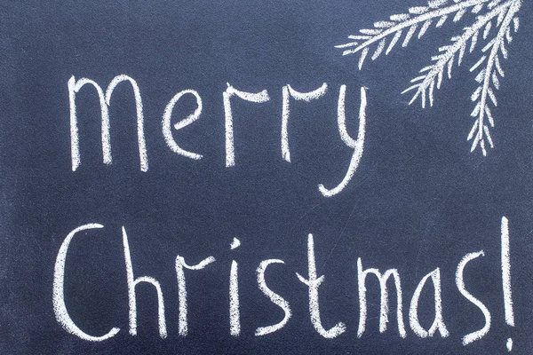 Neşeli Noel el Siyah Kara tahta tebeşir metin yazma.