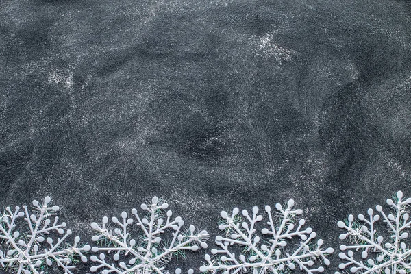 Snowflakes on a black chalkboard — Stock Photo, Image
