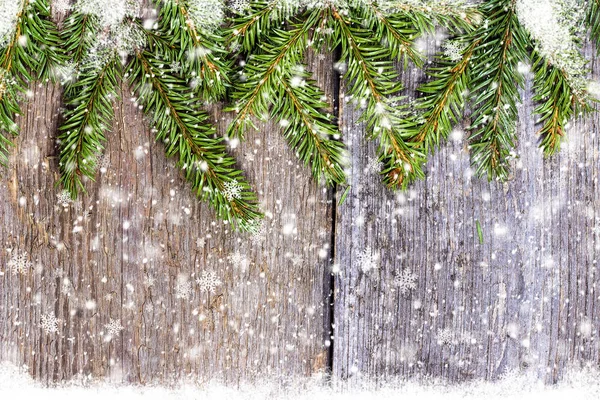 Decorated pine branches on wooden table free space — Stock Photo, Image