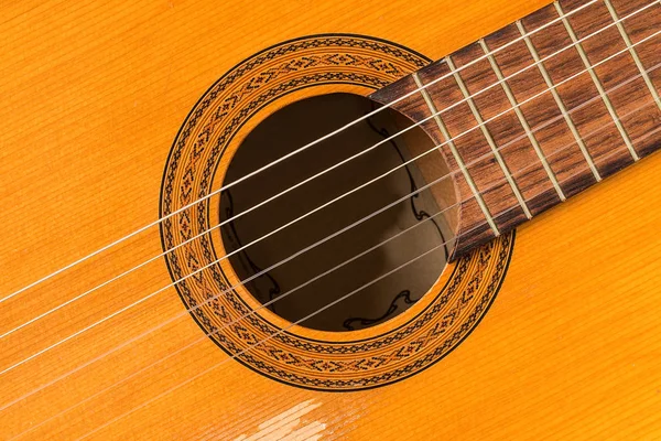 Close up on a classic guitar made of wood — Stock Photo, Image