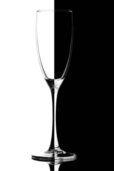 Empty wine glass isolated on black and white — Stock Photo, Image