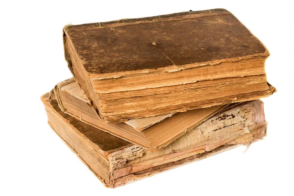 Old books piled together over white background Stock Image