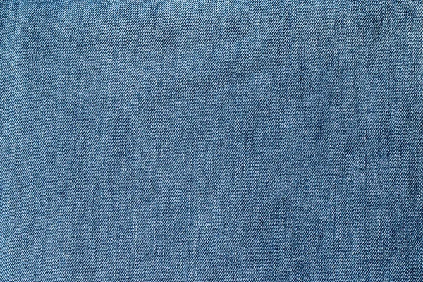 Фон из ткани синих джинсов — стоковое фото