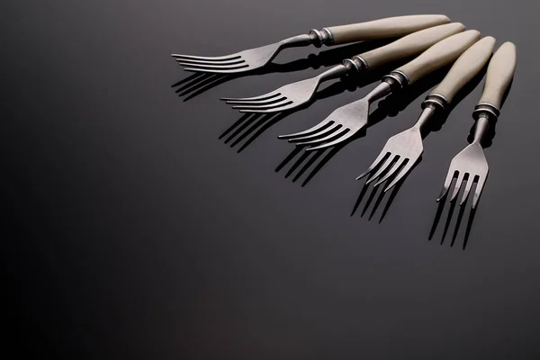 Set of forks. Five  pieces.  On  gray background — Stock Photo, Image