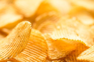 Sarı patates cipsi arka plan olarak, tatlı tuzlu.