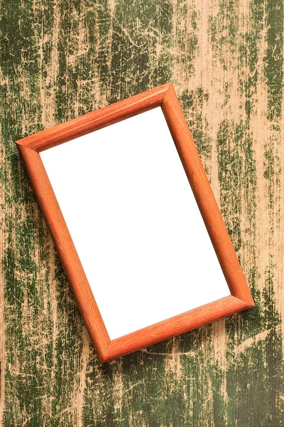 Empty  photo frame on the vintage green wooden desk table