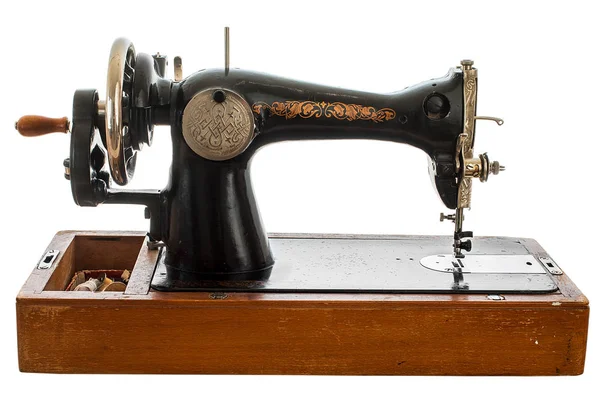 An old, hand sewing machine on white background Stock Picture