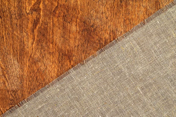 Textura de arpillera sobre fondo de mesa de madera — Foto de Stock