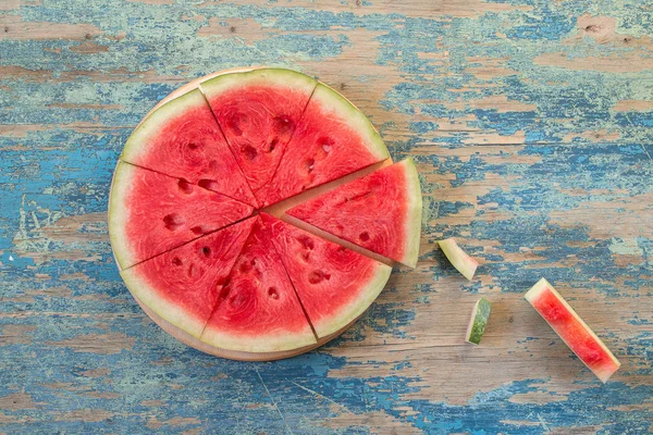 Slices of watermelon on wooden table — Stock Photo, Image