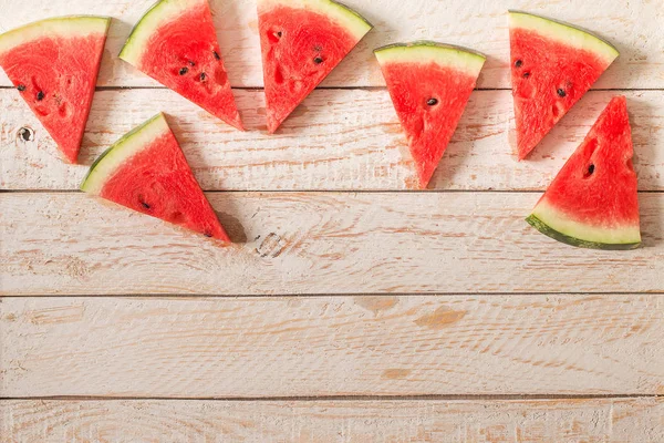 Slices of watermelon on wooden table. — Stock Photo, Image