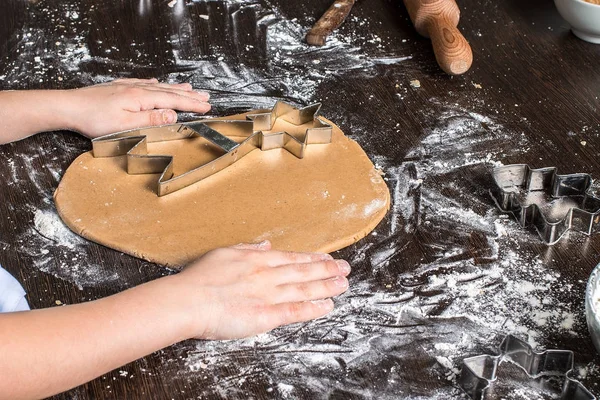 Cutting dough on different shapes. Christmas  gingerbread