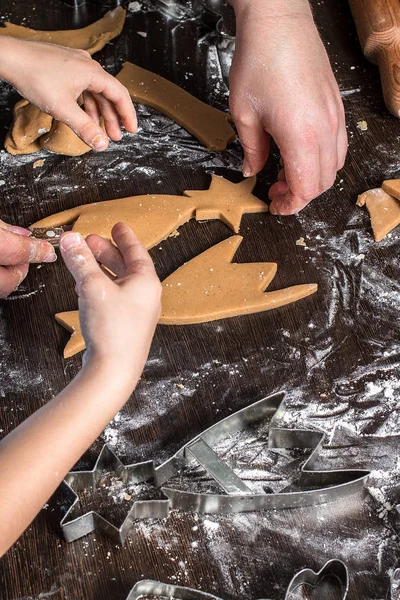 Cutting dough on different shapes. Christmas  gingerbread.