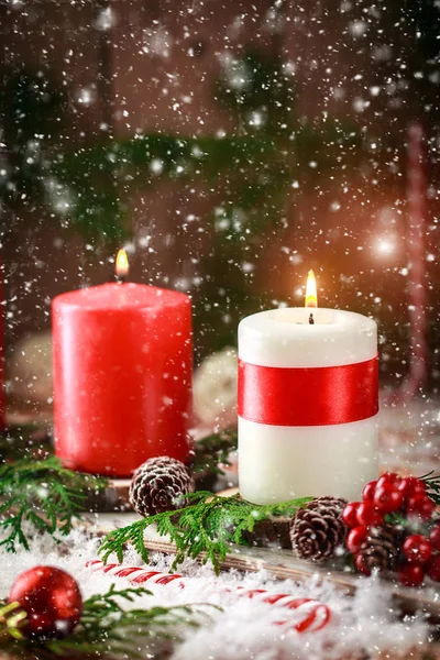 Christmas card with burning candles and decorations — Stock Photo, Image