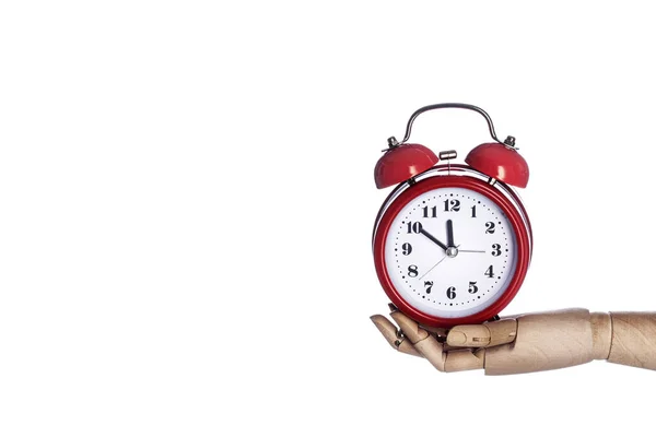 Wooden hand holding retro red alarm clock isolated on white back — ストック写真