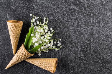 Ice cream cone with lilies of the valley.