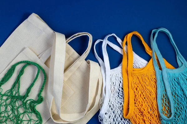 Zero waste concept. Textile eco bags on blue background