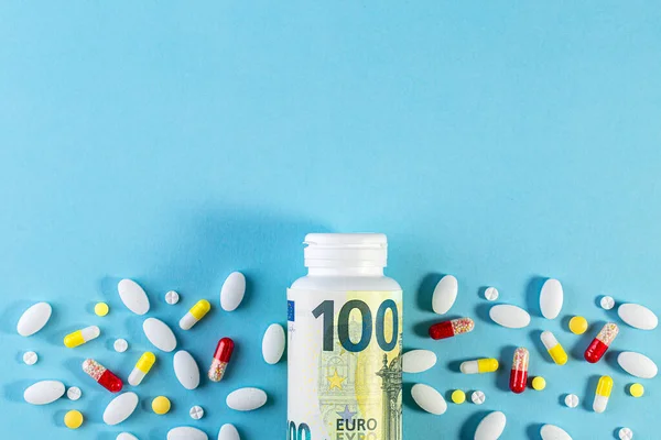 Money Pills Different Colors Blue Background Rising Cost Health Care — Stock Photo, Image