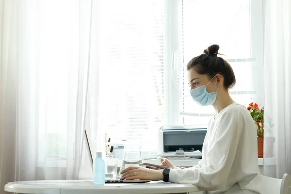 Woman work from home wearing mask protection wait for epidemic situation to improve soon at home. Coronavirus, covid-19, Work from home WFH, Social distancing, Quarantine, Prevent infection concept