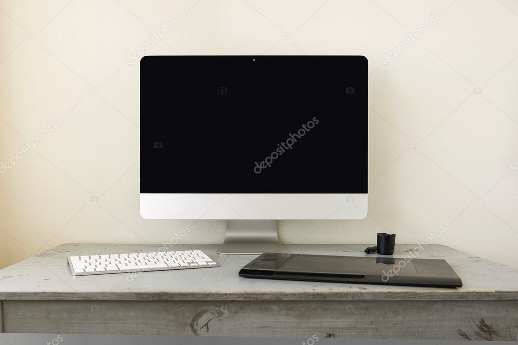 Computer with Keyboard and Graphic Tablet on Wooden Table and Space for Copy