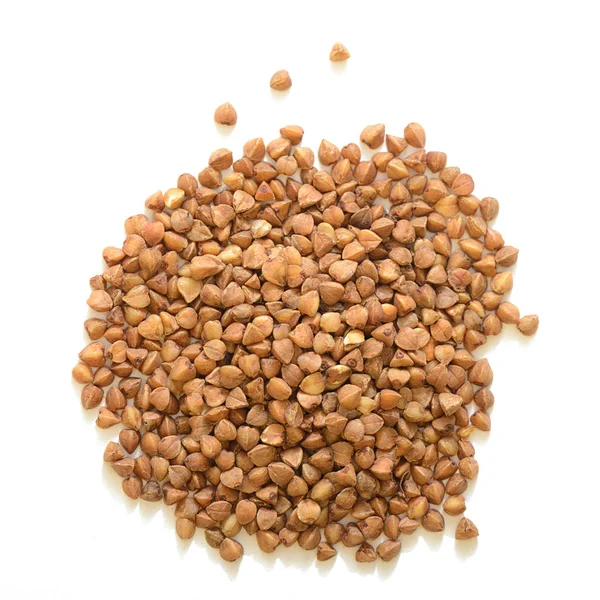 Heap of grains of buckwheat on a white background — Stock Photo, Image