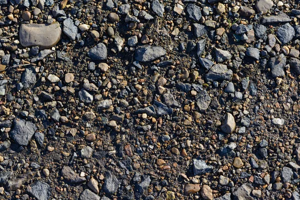 Szórás a kis kövek a földön — Stock Fotó