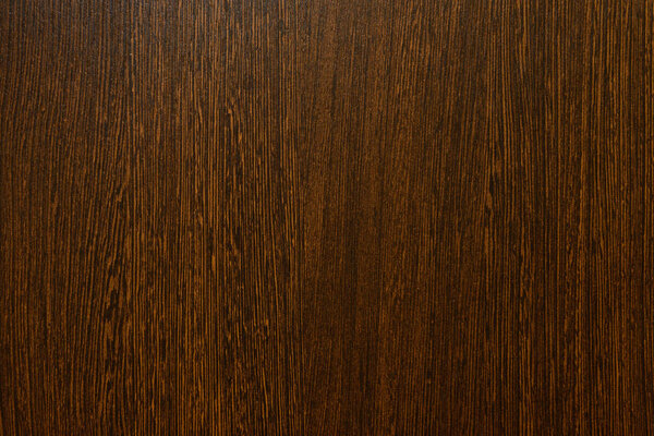 структура поверхности темного дерева с длинными вертикальными полосами
