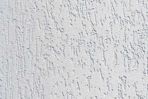 Surface plâtrée d'un mur avec des sillons de couleur bleu clair — Photo
