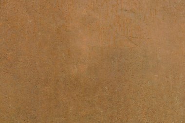 Tamamen paslı metal bir levhanın yüzeyi.