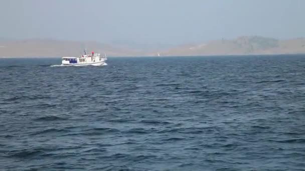 Nature of Lake Baikal. The ship is moving along the lake — Stock Video
