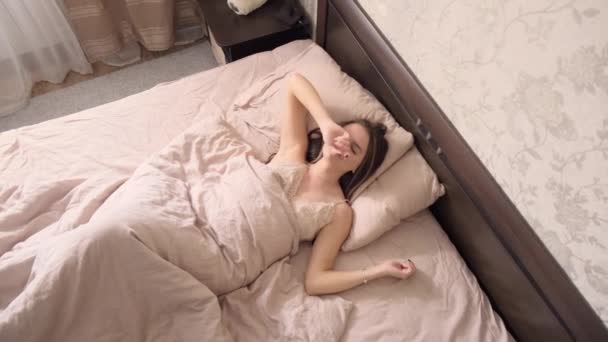 Young Girl Long Dark Hair Light Nightgown Wakes Large Bed — Stock Video