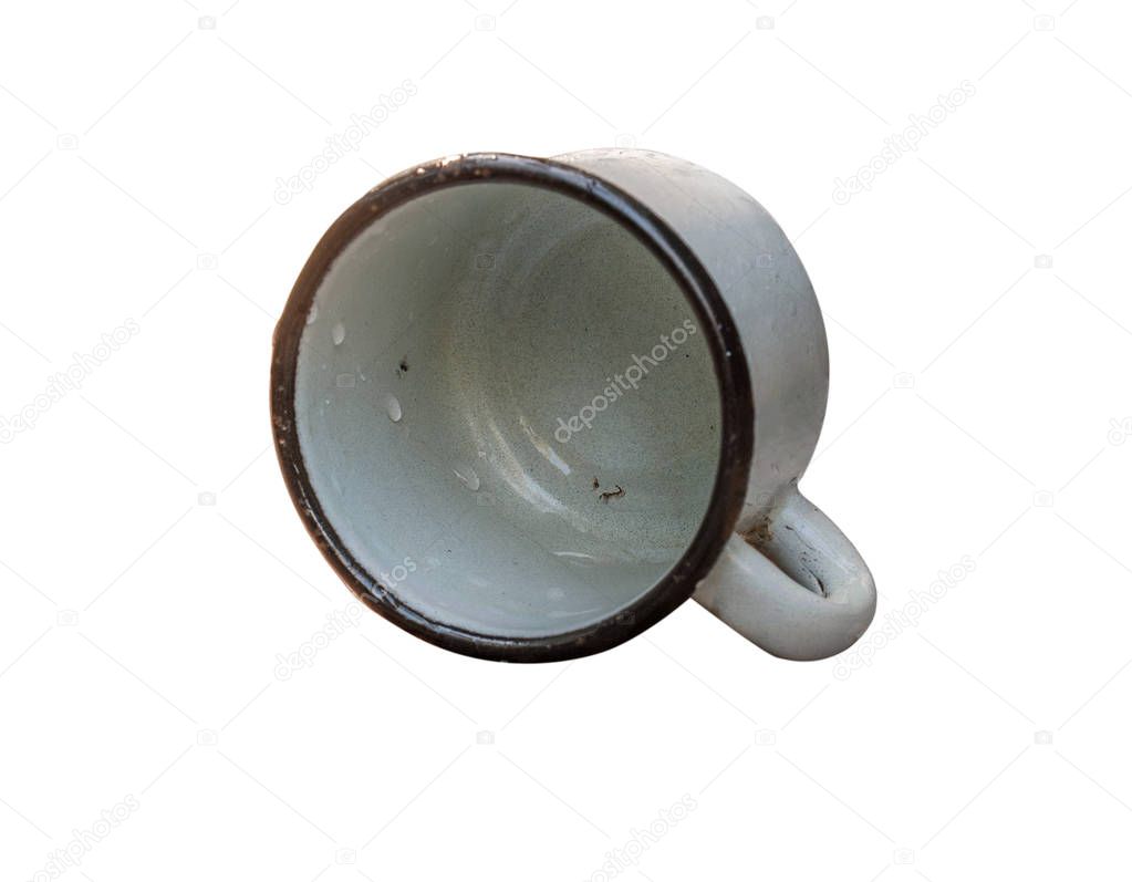 old enamel mug in drops of water isolated on white