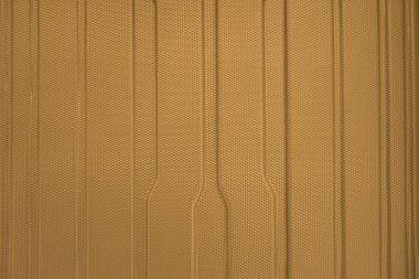 Altın kabartmalı plastik yüzeyin soyut arkaplanı