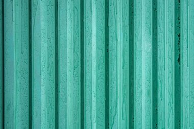 abstract background of turquoise painted metal surface close up