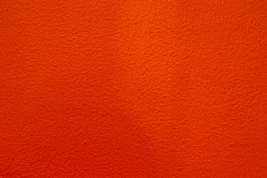 abstract background of painted red wall close up