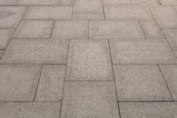 Granit levhalarla kaplı kaldırımın soyut arkaplanı