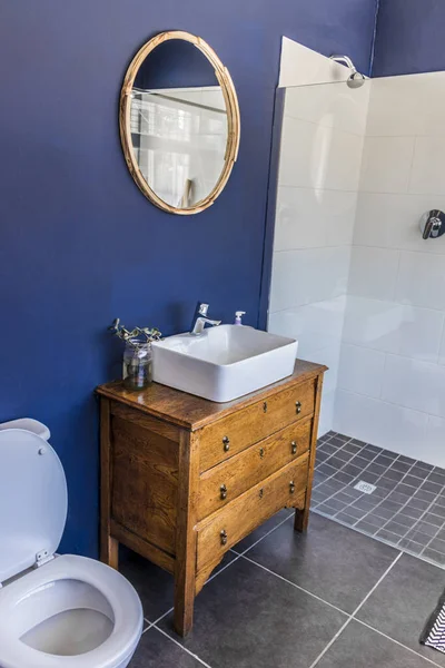 Noble bathroom, toilet in royal blue Cape Town, South Africa.