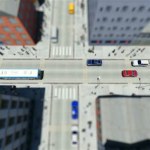 Tilt shift lopen mensen en verkeer in de stad