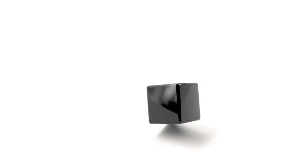 Cubo negro cae sobre una superficie blanca . — Vídeo de stock